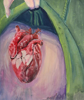 A human heart atop a chest underneath clothing